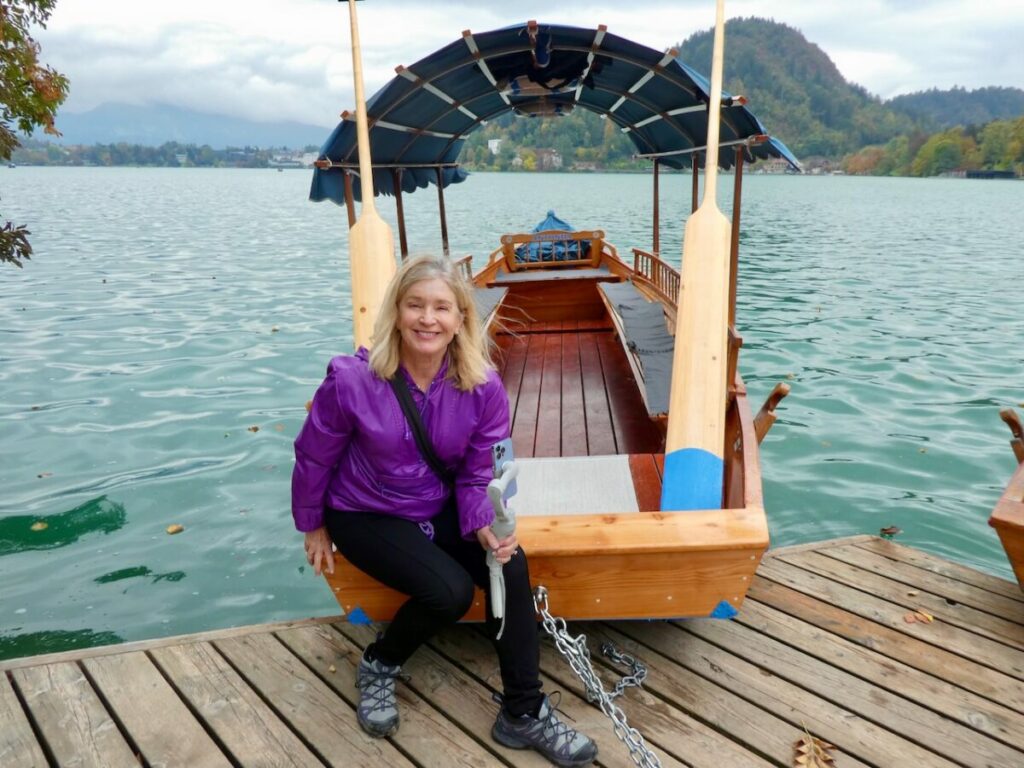 Terry Anzur on pletna boat in Lake Bled